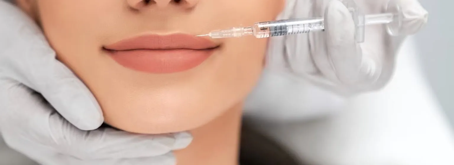 A filler injection being given to the lips